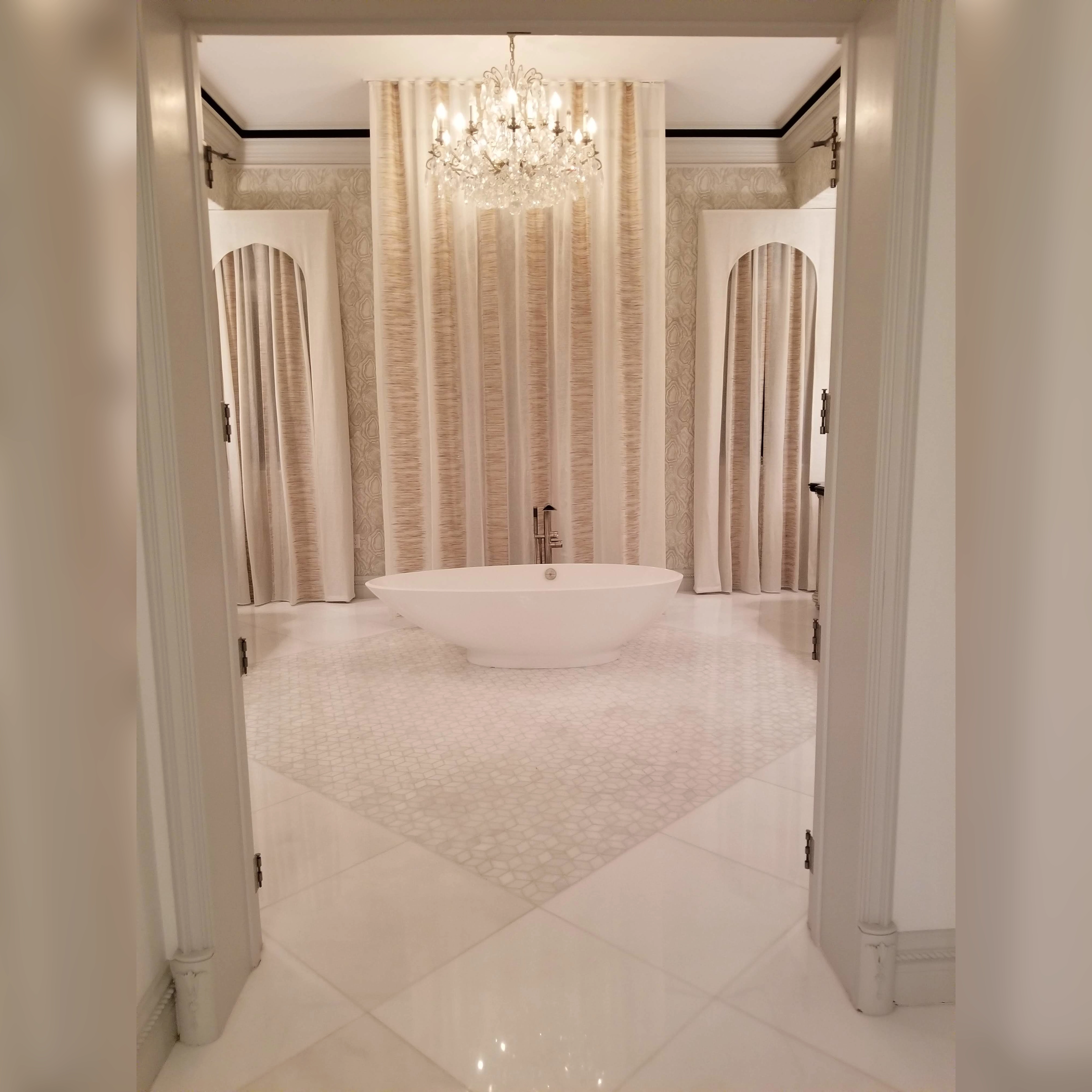 Elegant bathroom with stunning stone mosaic flooring, combining beauty and durability for a timeless, spa-like feel.